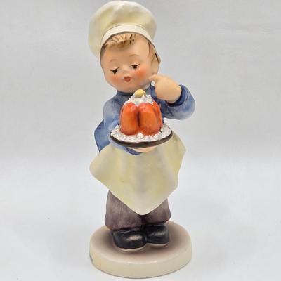 LOT 31D: Goebel Hummel Figurines Including Night Watchman, Little Pastry Cook, Little Hiker, Surprise AKA Hansel & Gretel, and Little...