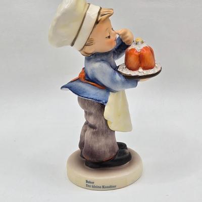 LOT 31D: Goebel Hummel Figurines Including Night Watchman, Little Pastry Cook, Little Hiker, Surprise AKA Hansel & Gretel, and Little...