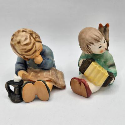 LOT 35D: Hummel Figurines Including Home From Market, Playmates, A nap, Angel with Accordion AKA Joyous News