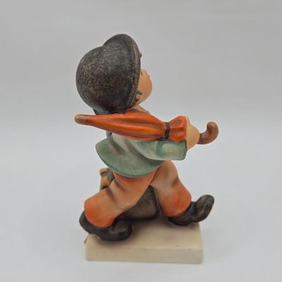 LOT 36D: Goebel Hummel Figurines Including Telling Her Secret, Trumpet Boy, Singing Lessons, Sensitive Hunter, and Merry Wanderer