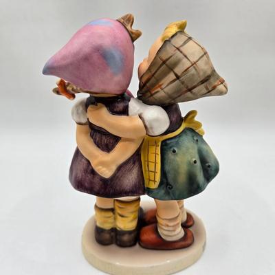 LOT 36D: Goebel Hummel Figurines Including Telling Her Secret, Trumpet Boy, Singing Lessons, Sensitive Hunter, and Merry Wanderer