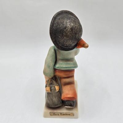 LOT 36D: Goebel Hummel Figurines Including Telling Her Secret, Trumpet Boy, Singing Lessons, Sensitive Hunter, and Merry Wanderer