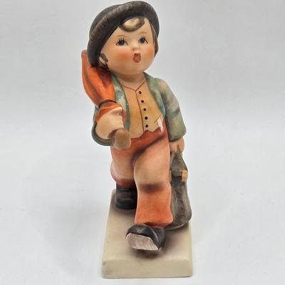 LOT 36D: Goebel Hummel Figurines Including Telling Her Secret, Trumpet Boy, Singing Lessons, Sensitive Hunter, and Merry Wanderer