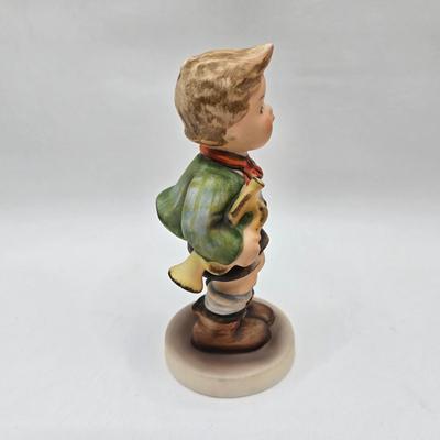 LOT 36D: Goebel Hummel Figurines Including Telling Her Secret, Trumpet Boy, Singing Lessons, Sensitive Hunter, and Merry Wanderer