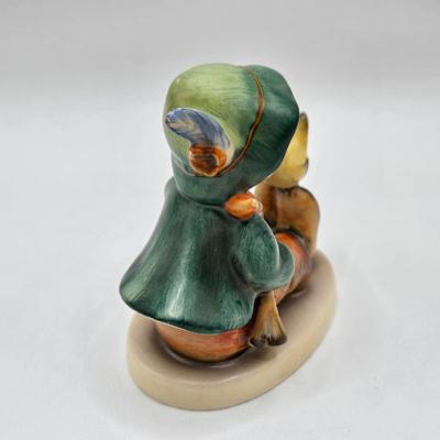 LOT 36D: Goebel Hummel Figurines Including Telling Her Secret, Trumpet Boy, Singing Lessons, Sensitive Hunter, and Merry Wanderer
