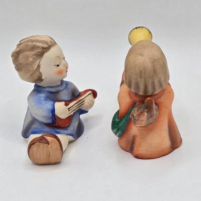 LOT 38D: Hummels Including Goose Girl, Feeding Time, Angel with Trumpet, and Angel with Lute