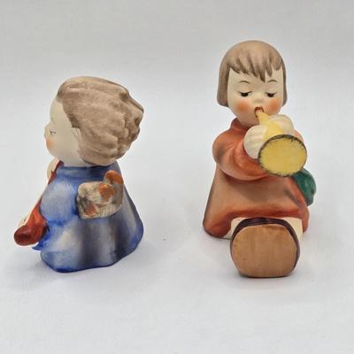 LOT 38D: Hummels Including Goose Girl, Feeding Time, Angel with Trumpet, and Angel with Lute