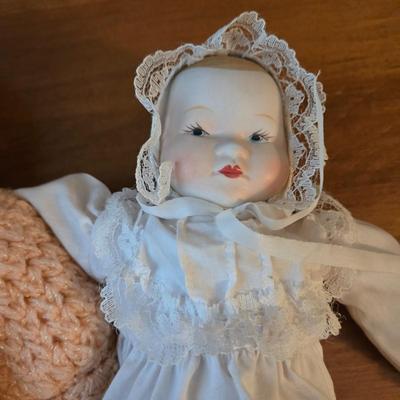 LOT 47D: Wooden Cradle with Music Box, Imperial Crown Toy Baby Doll, and Porcelain Baby Doll
