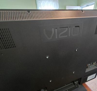 LOT 64L: Vizio TV with Remote and Wooden Table