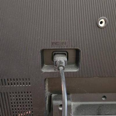 LOT 64L: Vizio TV with Remote and Wooden Table