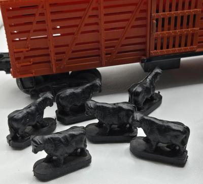 LOT 105X: Lionel Train Cars, Stockyard, and More