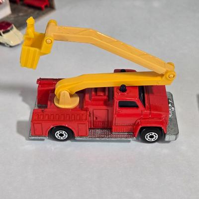 LOT 164X: Multiple Toy Accessories Including Matchbox Fire Truck, Charlies's Angels Van, Plastic Train Station, Plastic and Metal...
