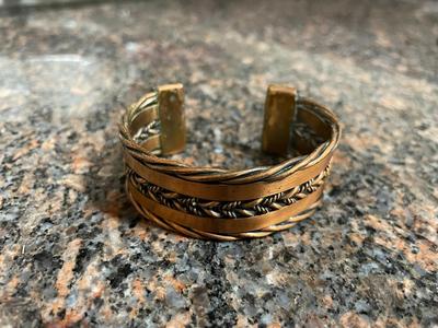 Two Metal Cuff Bracelets with Artisan Designs