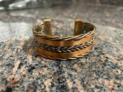 Two Metal Cuff Bracelets with Artisan Designs