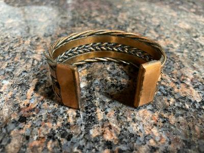 Two Metal Cuff Bracelets with Artisan Designs