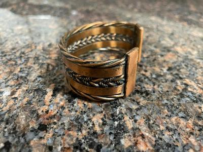 Two Metal Cuff Bracelets with Artisan Designs