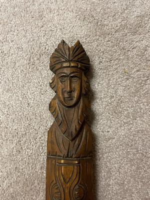 Hand-Carved Wooden Sculpture of a Person in Headdress