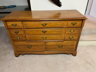 Wooden Dresser with Brass Hardware and Multiple Drawers