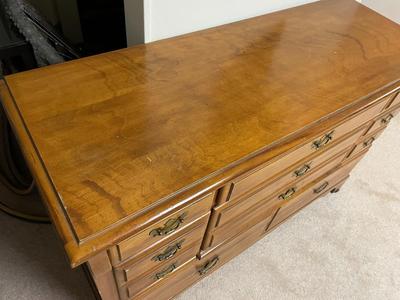 Wooden Dresser with Brass Hardware and Multiple Drawers