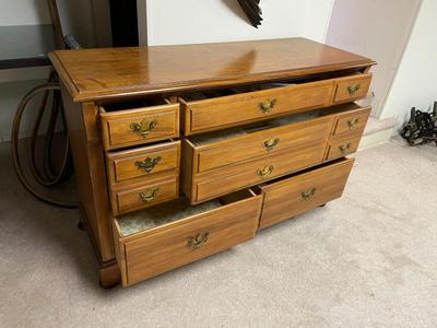 Wooden Dresser with Brass Hardware and Multiple Drawers