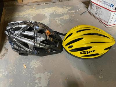 Two Bicycle Helmets, Black/Orange and Yellow Giro