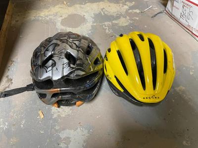 Two Bicycle Helmets, Black/Orange and Yellow Giro