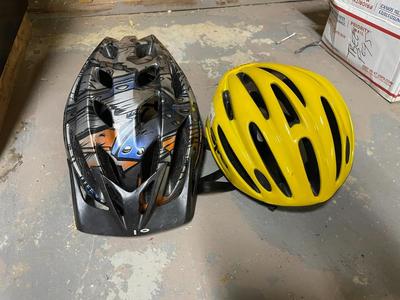 Two Bicycle Helmets, Black/Orange and Yellow Giro