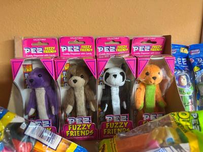 PEZ IN PACKAGES AND TROLL DOLLS
