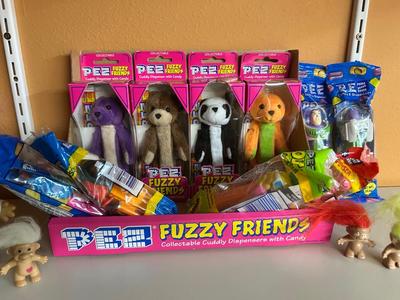 PEZ IN PACKAGES AND TROLL DOLLS