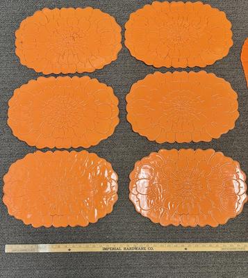Lot of 8 bright orange plastic placemats - 2 are slightly different