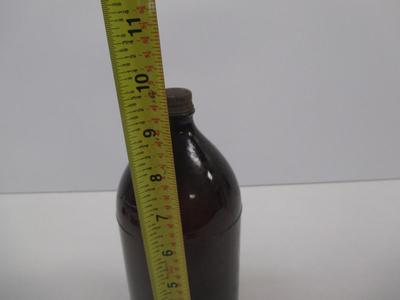 Vintage Brown Bottle With Cap Stamped On The Bottom