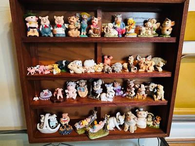 DISPLAY CASE PACKED FULL OF PIGS