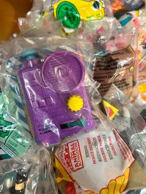 SO MANY HAPPY MEAL TOYS IN PACKAGES