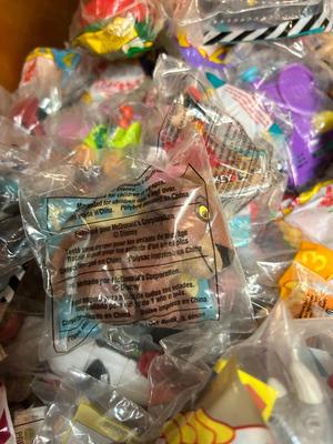 SO MANY HAPPY MEAL TOYS IN PACKAGES