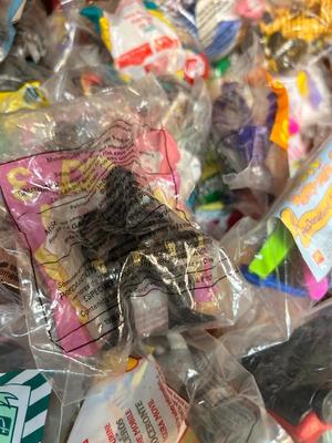 SO MANY HAPPY MEAL TOYS IN PACKAGES