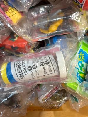 SO MANY HAPPY MEAL TOYS IN PACKAGES