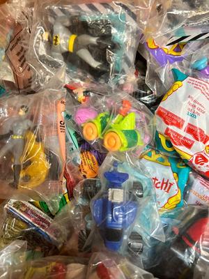 SO MANY HAPPY MEAL TOYS IN PACKAGES