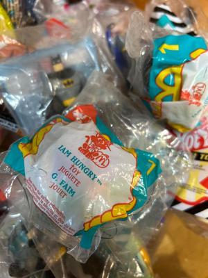 SO MANY HAPPY MEAL TOYS IN PACKAGES