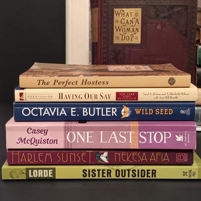 LOT 400: Collection of Books by Women- Octavia E. Butler, Whoopi Goldberg, Ellen Hart & More