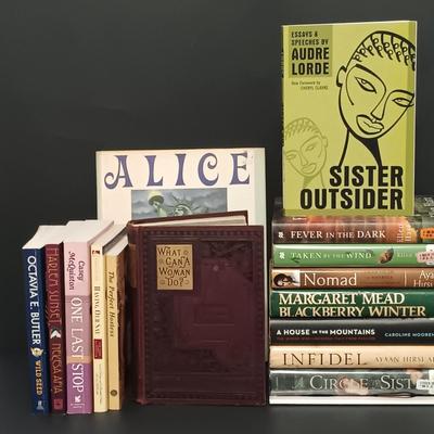 LOT 400: Collection of Books by Women- Octavia E. Butler, Whoopi Goldberg, Ellen Hart & More
