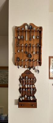 SOUVENIR SPOONS IN WOODEN RACKS