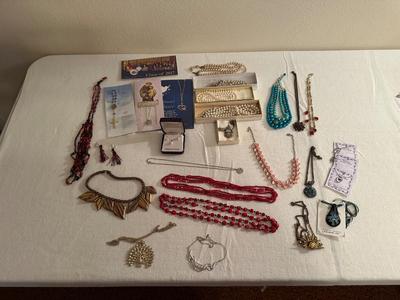 A VARIETY OF COSTUME JEWELRY