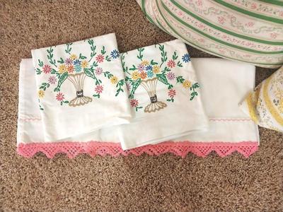 TWO FEATHER PILLOWS AND EMBROADERED PILLOWCASES