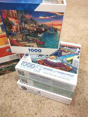 TWELVE PUZZLES MOST ARE 1000 PIECES