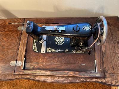 BRUNSWICK TREADLE SEWING MACHINE IN CABINET