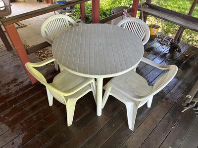PLASTIC PATIO TABLE AND 4 CHAIRS