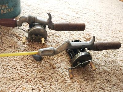 VINTAGE FISHING POLES AND FLOATING MINNOW BUCKET