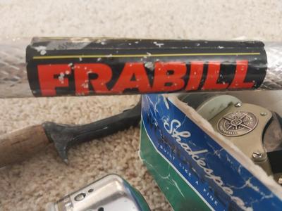 FISHING POLE-NET AND SHAKESPEARE REELS