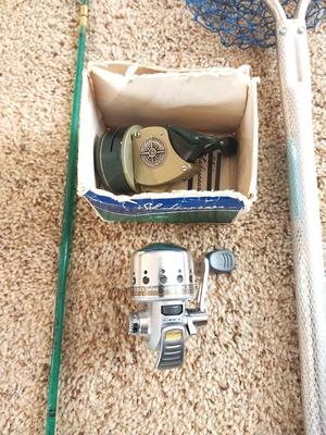FISHING POLE-NET AND SHAKESPEARE REELS