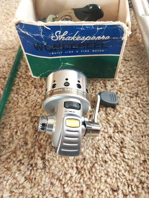 FISHING POLE-NET AND SHAKESPEARE REELS